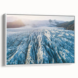 Framed canvas wall art showcasing a stunning glacier landscape design, featuring vibrant blues and whites, set against a sleek white frame for a modern touch.