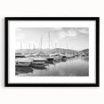 Framed black wall art showcasing a serene harbor landscape with calming colors, perfect for home decor and enhancing any interior space.