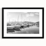 Framed black wall art showcasing a serene harbor landscape with calming colors, perfect for home decor and enhancing any interior space.