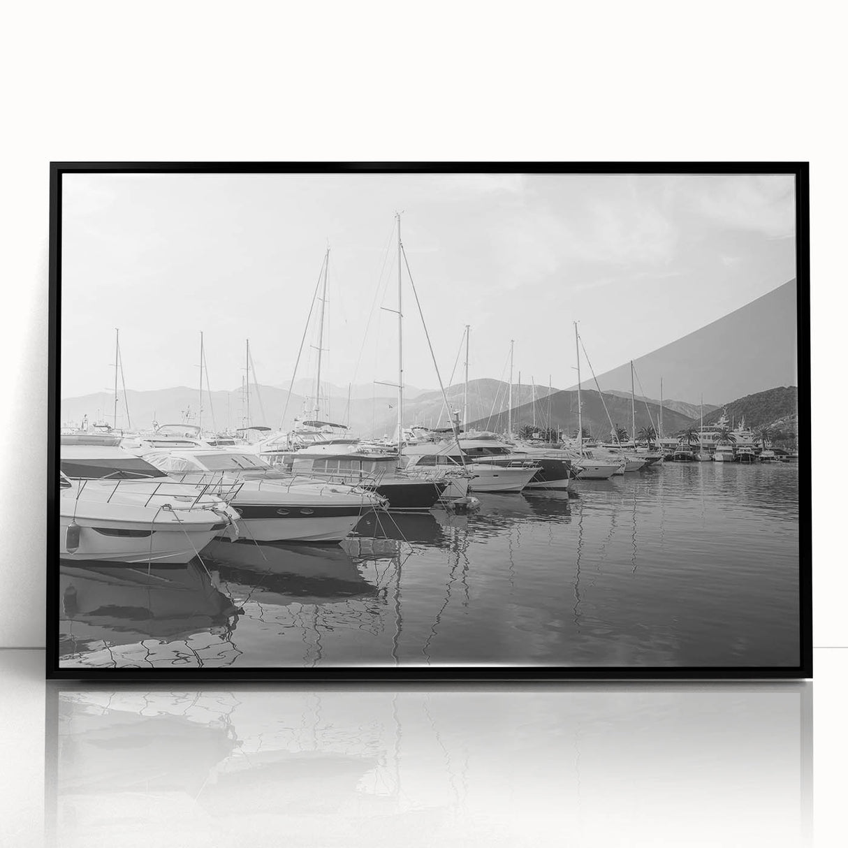 Framed acrylic wall art showcasing a serene harbor landscape design with a black frame, adding elegance to home decor. Ideal for nautical-themed interiors.