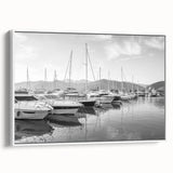 Framed canvas wall art showcasing a serene harbor landscape design, featuring calming blue and white hues, displayed in a sleek white frame for elegant decor.