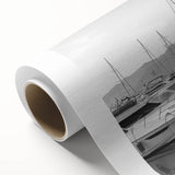 Rolled canvas showcasing a serene harbor landscape design, featuring calming blues and greens, elegantly packaged in a protective cardboard tube for easy display.