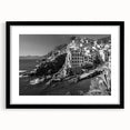 Framed black wall art featuring a serene harbor landscape design, accented by a white mat, perfect for modern home decor and enhancing interior aesthetics.