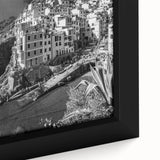 Close-up of a framed canvas featuring a vibrant harbor landscape design, showcasing rich colors and intricate details, perfect for enhancing home decor.