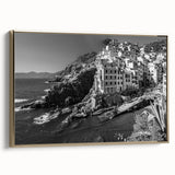 Framed canvas wall art showcasing a serene harbor landscape design with golden accents, elegantly displayed from a side view, ideal for modern home decor.