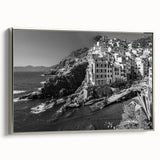 Framed canvas wall art showcasing a serene harbor landscape with soft colors, silver frame accents, perfect for enhancing modern home decor.