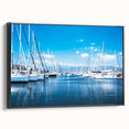 Framed canvas wall art showcasing a serene harbor landscape design, featuring calming blue and green hues, with a sleek black frame, perfect for modern decor.
