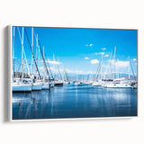 Framed canvas wall art depicting a serene harbor landscape, featuring soft blue and green hues with white framing, ideal for enhancing home decor.