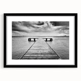 Framed wall art featuring a serene harbor landscape design with a black matte frame, perfect for enhancing home decor and creating a tranquil atmosphere.
