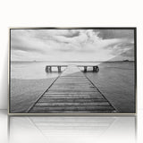 Framed acrylic wall art featuring a contemporary harbor design in silver tones, showcasing a scenic waterfront view, perfect for modern home decor.
