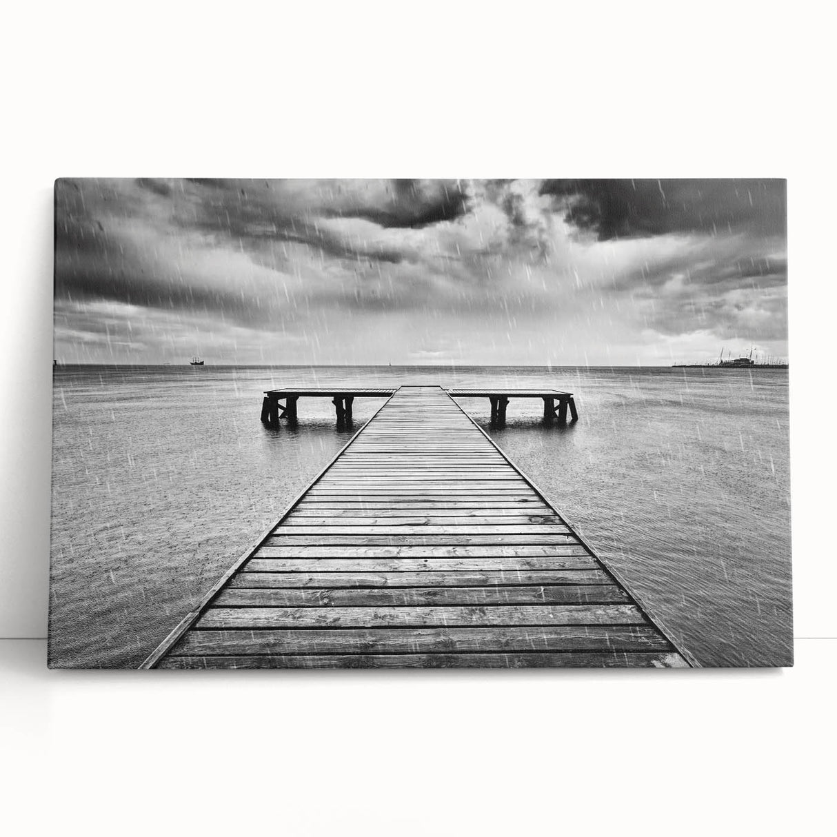 Stretched canvas wall art featuring a serene harbor landscape design in calming blue and green tones, elegantly leaning against a neutral wall, perfect for home decor.