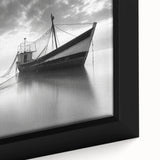 Close-up of a framed canvas wall art piece depicting a serene harbor landscape, showcasing vibrant blue water and detailed boat designs, perfect for home decoration.