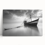 Stretched canvas artwork depicting a serene harbor landscape, featuring vivid colors and intricate details, elegantly leaning against a wall for stylish home decor.
