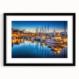 Framed black wall art featuring a serene harbor landscape design with a mat, ideal for home decor. The artwork showcases soft colors and intricate details, enhancing any interior space.