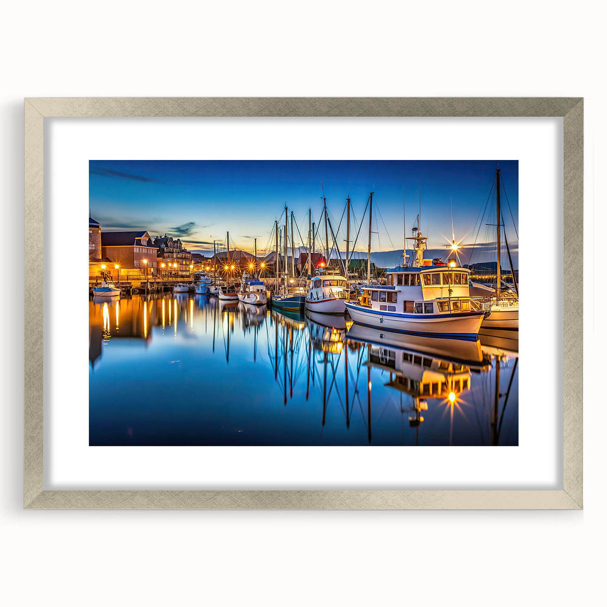 Framed wall art featuring a serene harbor landscape design, showcasing calming colors and intricate details, presented in a stylish silver frame with matting. Ideal for enhancing home decor and creating a tranquil atmosphere.