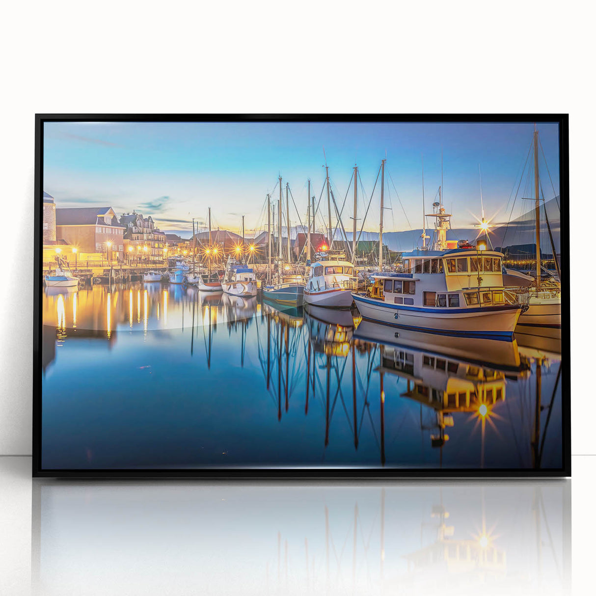 Framed acrylic wall art featuring a serene harbor landscape design with vibrant colors, set against a sleek black frame, perfect for modern home decor.