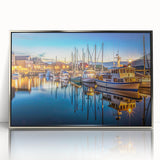 Framed acrylic wall art featuring a serene harbor landscape design with silver accents, perfect for home decor. Ideal for creating a calming atmosphere in any room.