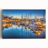 Stretched canvas artwork showcasing a vibrant harbor landscape with serene water reflections and colorful boats, perfect for enhancing home decor.
