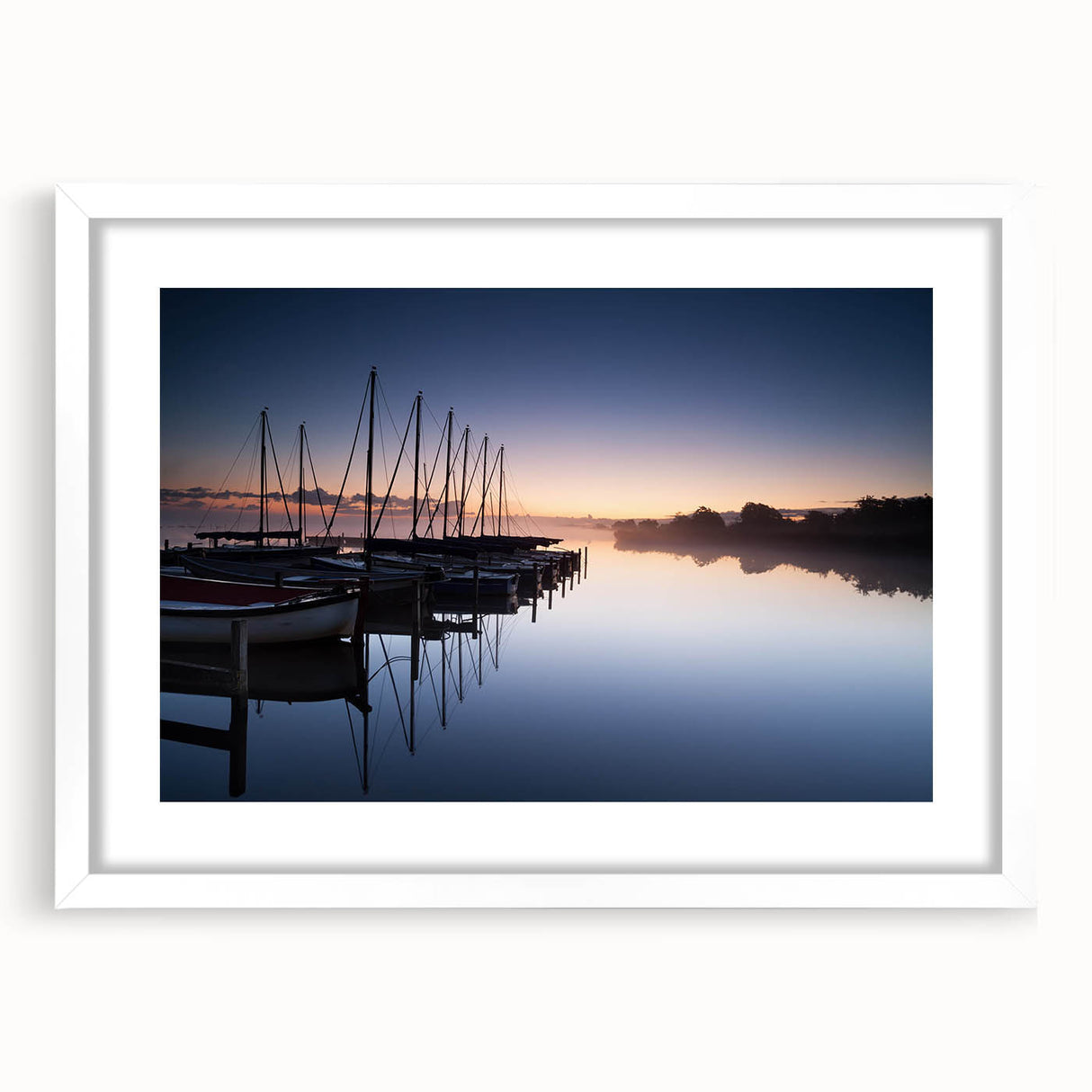 Framed wall art from the Landscapes Harbor Design collection featuring serene coastal imagery with a white mat and sleek frame, perfect for enhancing home decor.