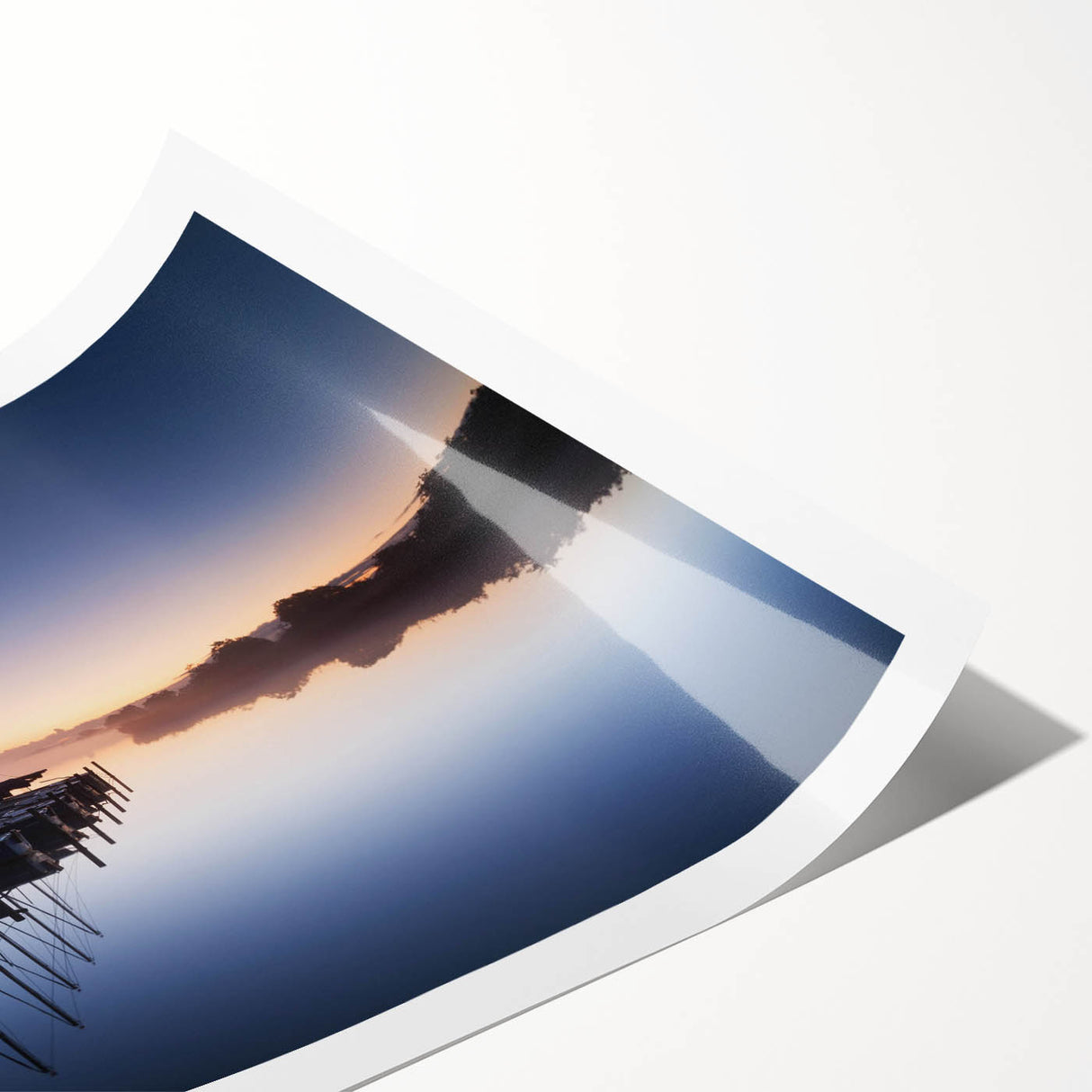 Rolled print of a serene harbor landscape design showcasing vibrant blues and greens, ideal for home decor. Packaged securely in a cardboard tube for protection.