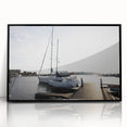 Framed acrylic wall art featuring a serene harbor landscape design, with a sleek black frame, perfect for coastal-themed home decor. Ideal for enhancing living spaces.