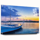 Acrylic glass wall art piece showcasing a serene harbor landscape design, featuring vibrant colors and intricate details, displayed at an angle with pins for mounting.