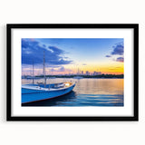 Framed wall art showcasing a serene harbor landscape with vibrant colors and intricate details, featuring a sleek black frame and white mat, perfect for home decor.