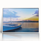 Framed acrylic wall art of a serene harbor landscape showcasing vibrant blues and greens, elegantly displayed with a white frame, ideal for modern home decor.