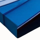 Close-up of a vibrant stretched canvas artwork showcasing a serene harbor landscape, featuring rich blues and greens, perfect for home decor enhancement.