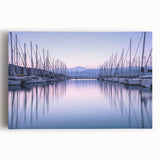Stretched canvas artwork showcasing a serene harbor landscape with vibrant blues and greens, framed in a modern design, perfect for home decor.
