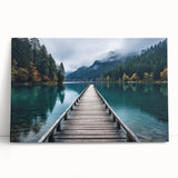 Stretched canvas wall art showcasing a serene harbor landscape design with vibrant colors, leaning against a white wall, perfect for home decor.