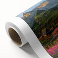 Rolled canvas artwork showcasing a serene harbor landscape with vibrant colors and intricate details, designed to enhance home decor, packaged securely in a cardboard tube.