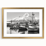 Framed landscape art print featuring a serene harbor scene, elegantly matted and surrounded by a gold frame, perfect for enhancing home decor aesthetics.
