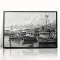 Framed acrylic wall art featuring a serene harbor landscape with vibrant blue waters and lush greenery, elegantly displayed in a sleek black frame, perfect for modern home decor.