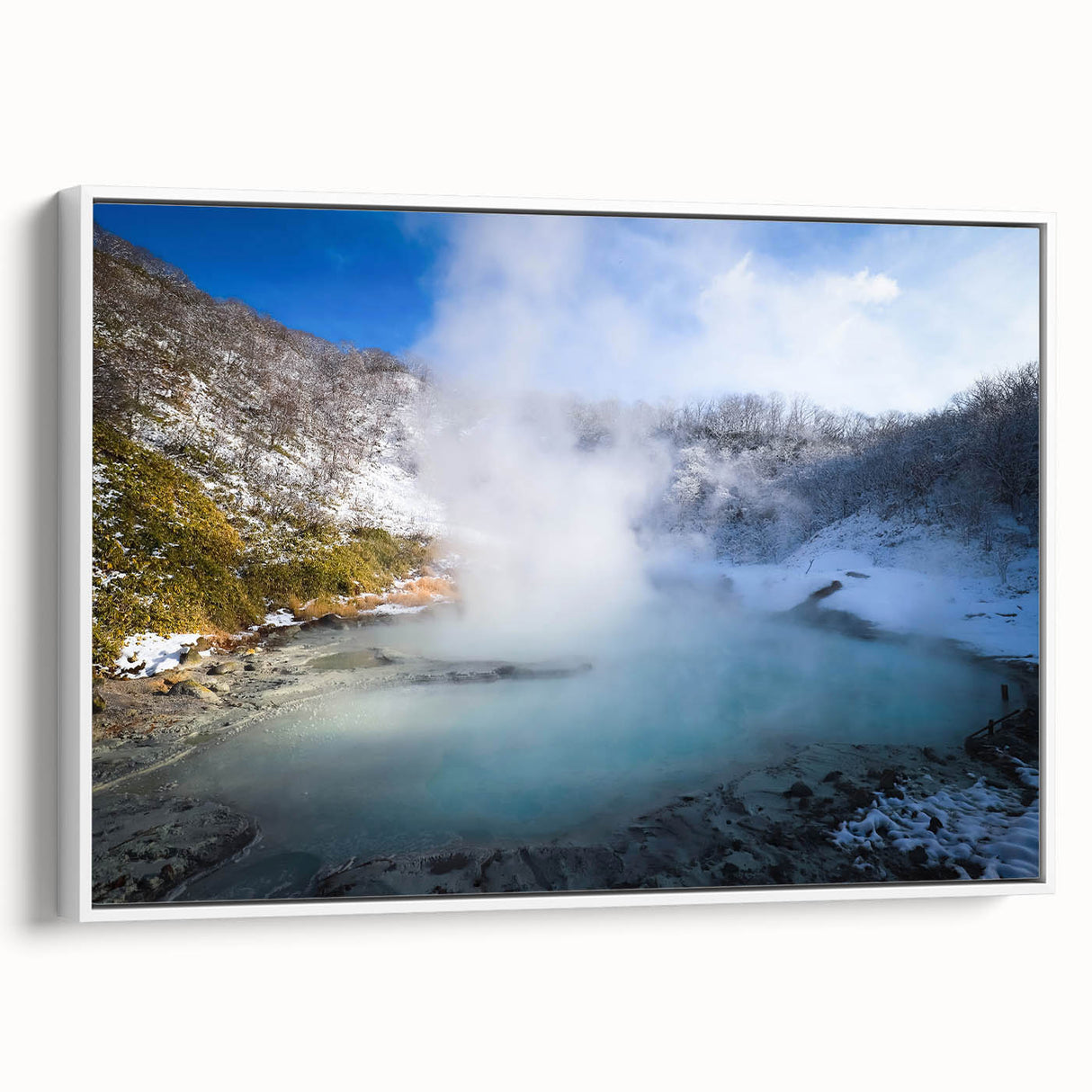 Framed wall art featuring a serene hot spring landscape design, showcasing vibrant colors and intricate details, perfect for home decor enhancement. The artwork is presented in a sleek white frame, emphasizing the natural beauty of the scene.