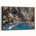 Framed canvas wall art showcasing a serene hot spring landscape design, featuring vibrant colors and intricate details, presented from a side view on a black frame.