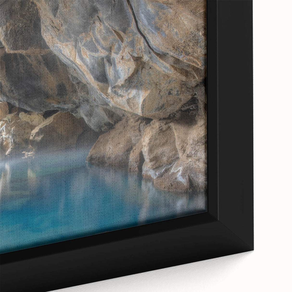 Close-up of a framed canvas artwork depicting a vibrant hot spring landscape, showcasing vivid colors and intricate details, perfect for home decor.