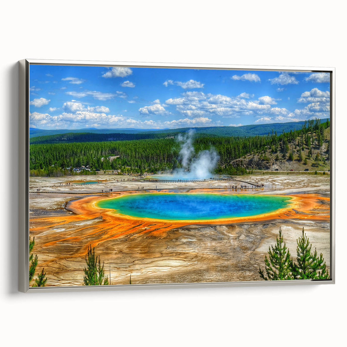 Framed canvas wall art depicting a serene hot spring landscape with lush greenery and soft blue water, accented by a sleek silver frame, ideal for modern decor.