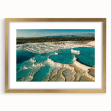 Framed wall art featuring a serene hot spring landscape design, highlighted with gold accents and a mat, ideal for adding elegance to home decor.