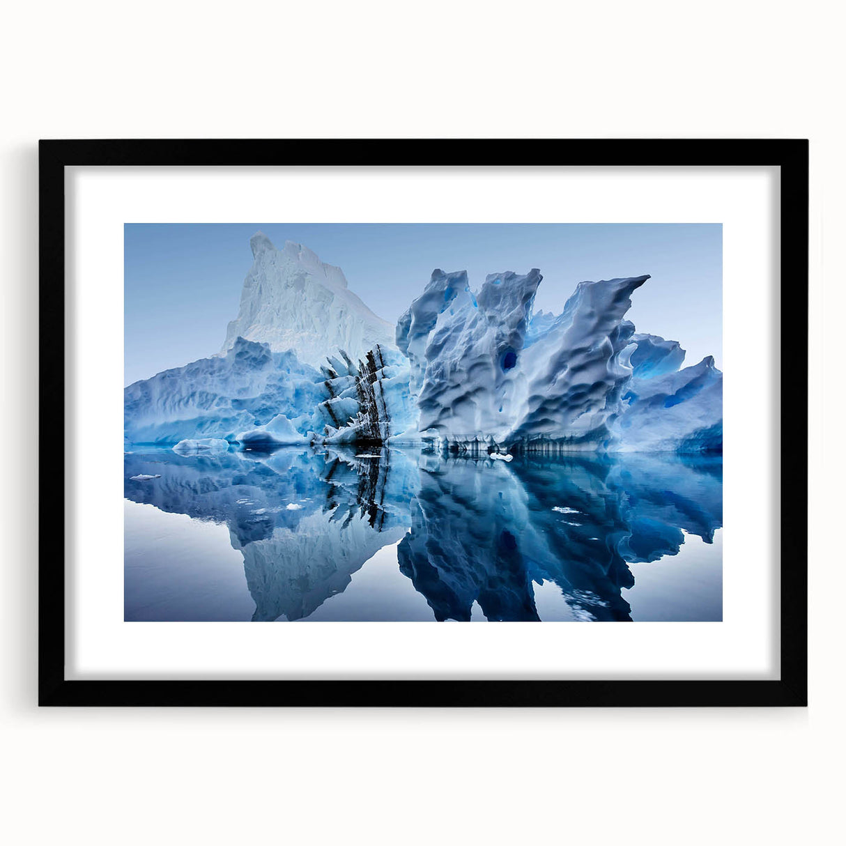 Framed black wall art showcasing a stunning iceberg landscape design, featuring vibrant blue and white tones with a sleek mat for a modern home decor accent.