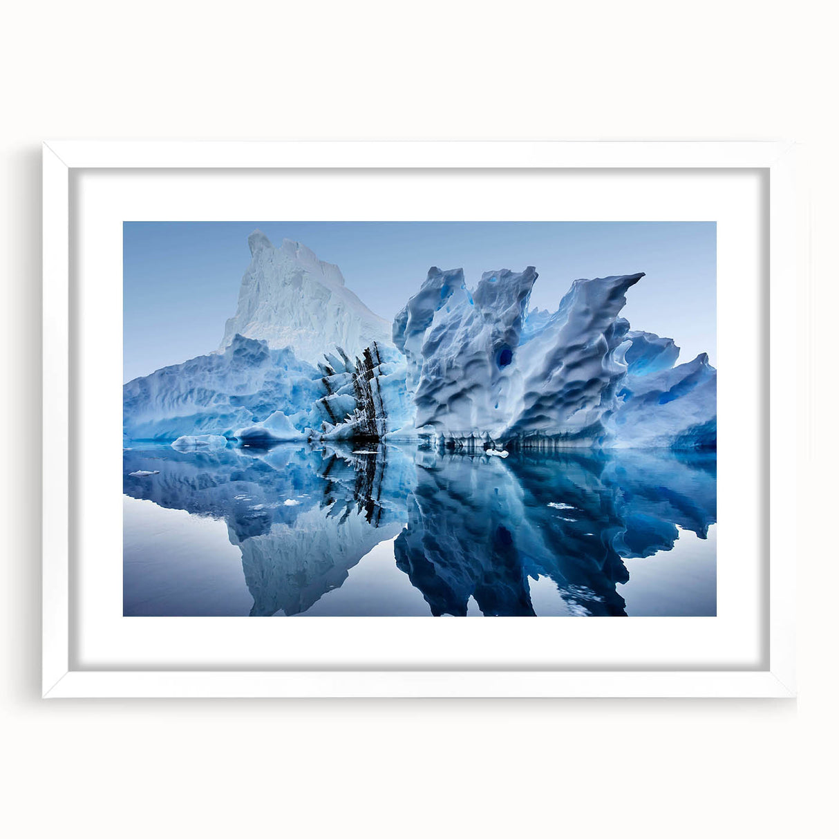 Framed landscape wall art showcasing a stunning iceberg design in soothing blue and white tones. The piece is elegantly matted and set in a sleek white frame, perfect for modern home decor.