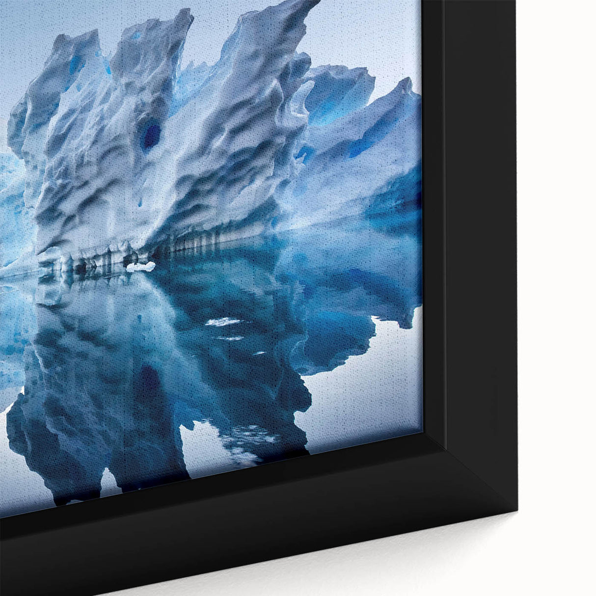 Close-up of a framed canvas wall art piece showcasing a stunning iceberg design, featuring shades of blue and white in a modern aesthetic, perfect for home decor.