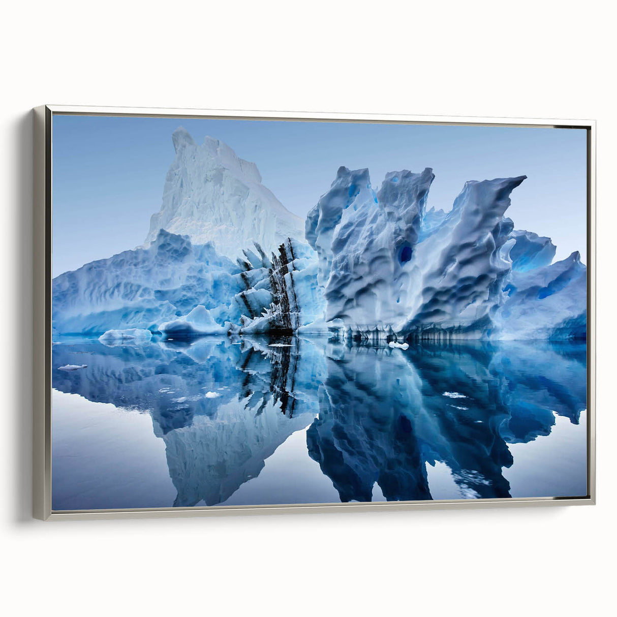Framed canvas wall art showcasing a modern iceberg design in silver tones, elegantly displayed from a side view, perfect for contemporary home decor.