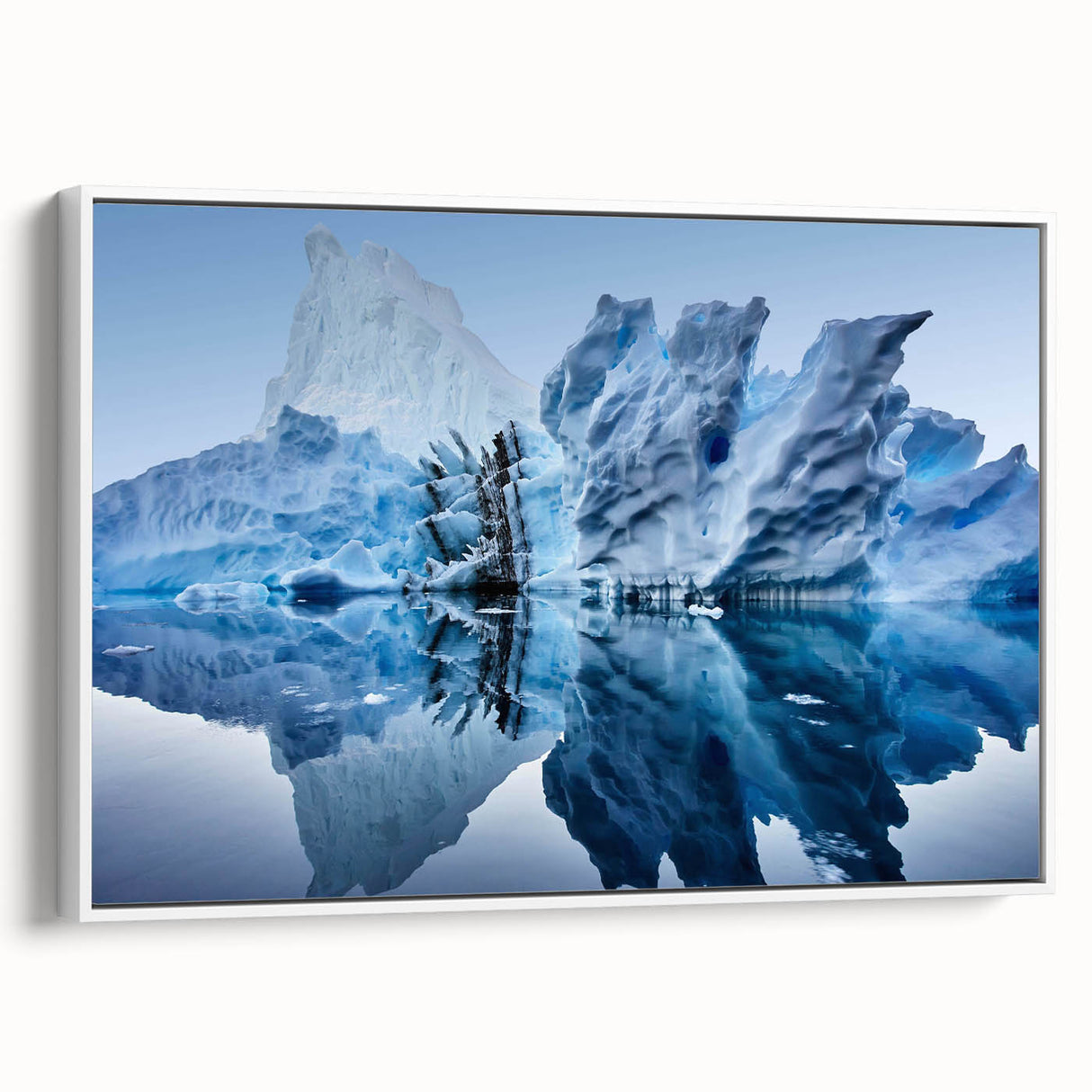 Framed canvas artwork showcasing a striking iceberg design, featuring cool blue and white tones, ideal for modern home decor. Side view highlights the frame's sleek profile.