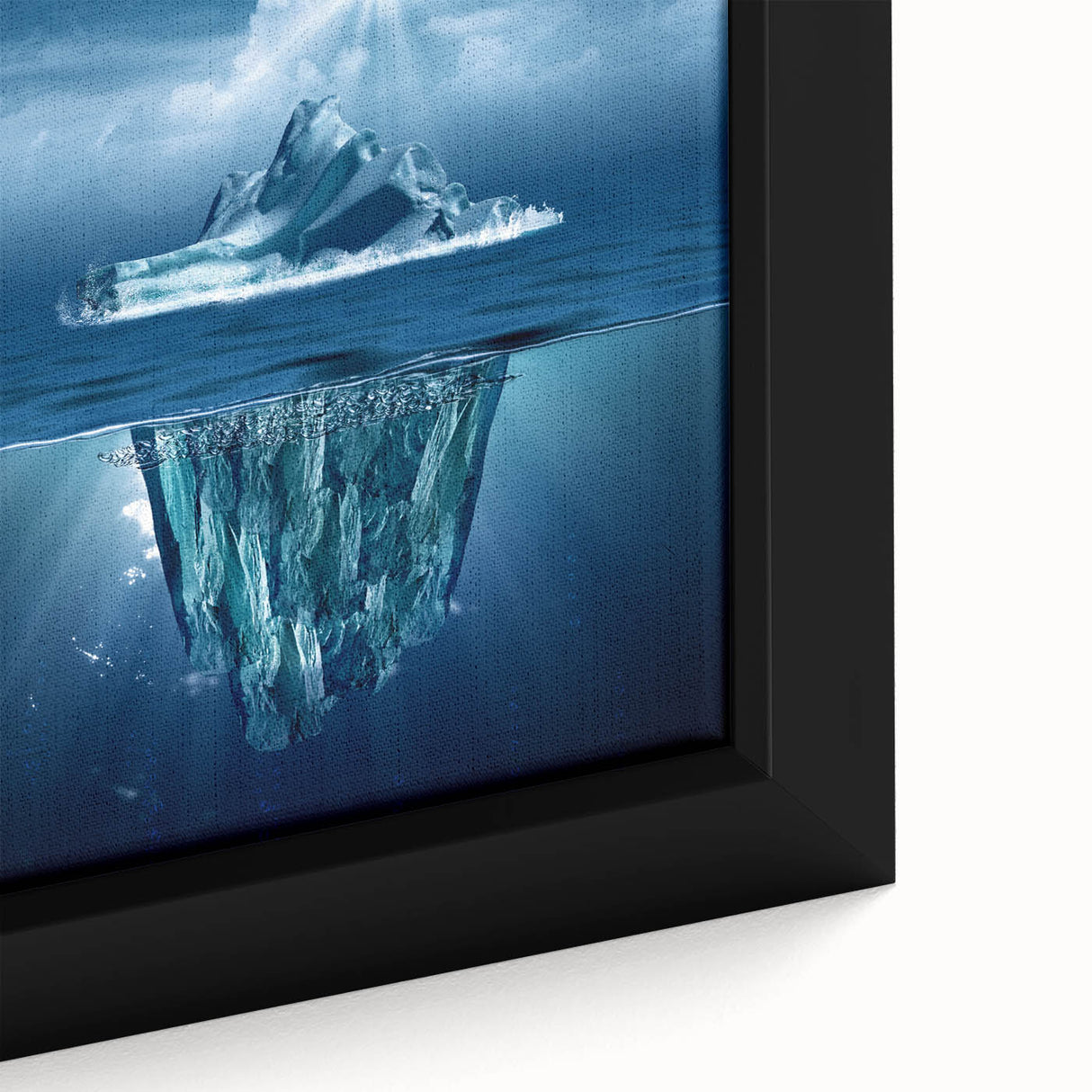 Close-up of a framed canvas wall art piece depicting a serene iceberg landscape, showcasing vibrant blues and whites, perfect for modern home decor.