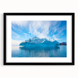 Black-framed wall art featuring a stunning iceberg landscape design, showcasing vibrant blues and whites that evoke a sense of tranquility, ideal for modern decor.