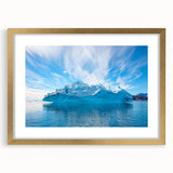 Framed landscape wall art featuring a stunning iceberg design, accented with a gold frame and mat, perfect for modern home decor. Ideal for adding elegance to any space.