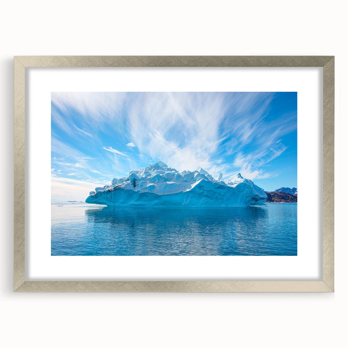 Framed wall art featuring a stunning iceberg landscape design in a silver frame with a mat, showcasing vibrant blues and whites, perfect for modern home decor.