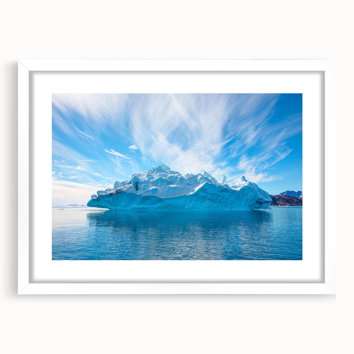 Framed iceberg landscape wall art with a white mat, showcasing serene icy blue tones and intricate details, ideal for modern home decor.
