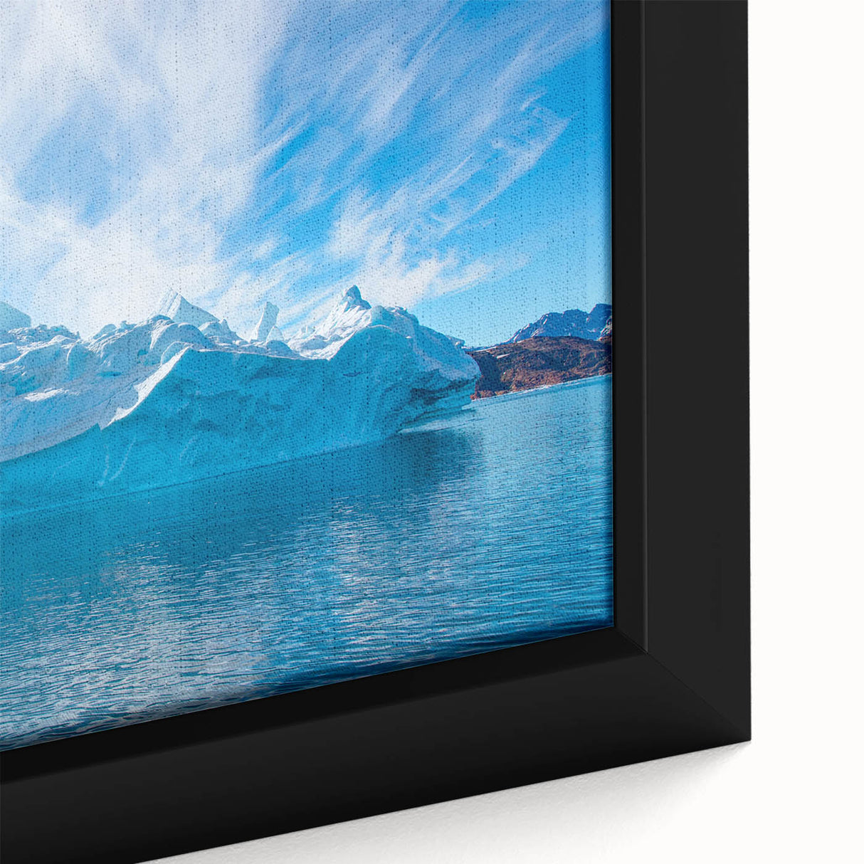 Close-up of a framed canvas wall art featuring a stunning iceberg landscape design, showcasing icy blue hues and intricate details in a modern home decor style.